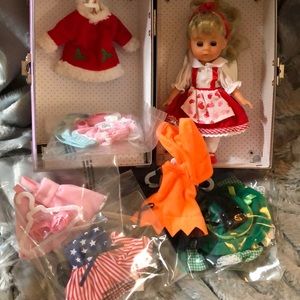 Doll with 8 Outfits and Pink Trunk